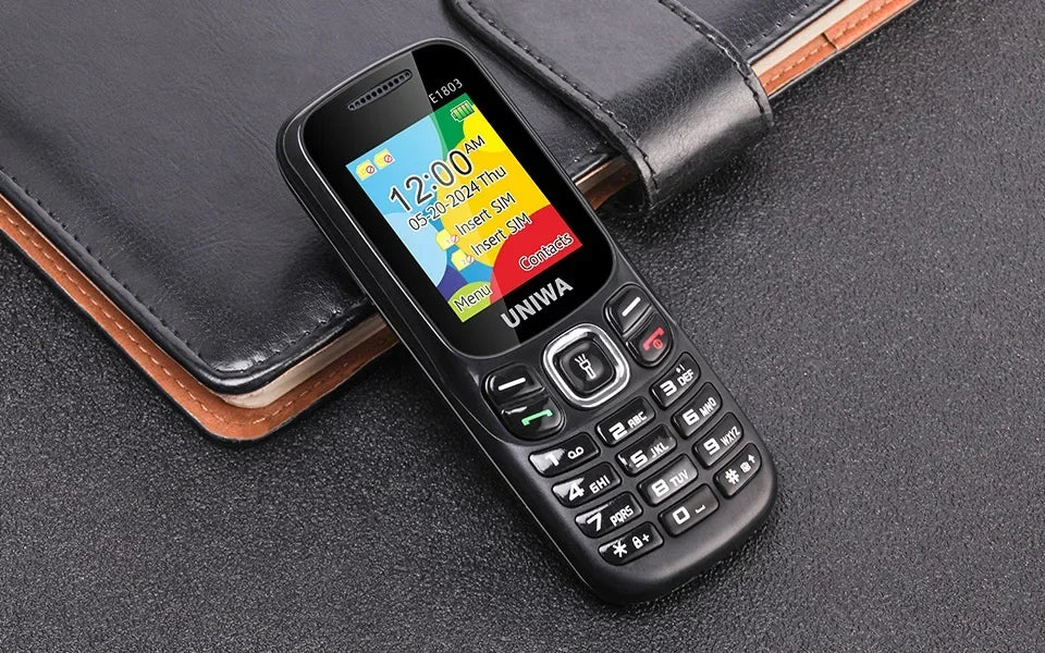 UNIWA E1803 2G precio bajo delgado GSM Mini teléfono móvil Dual SIM T9 teclado 800mAh batería Radio inalámbrica linterna teléfono para personas mayores