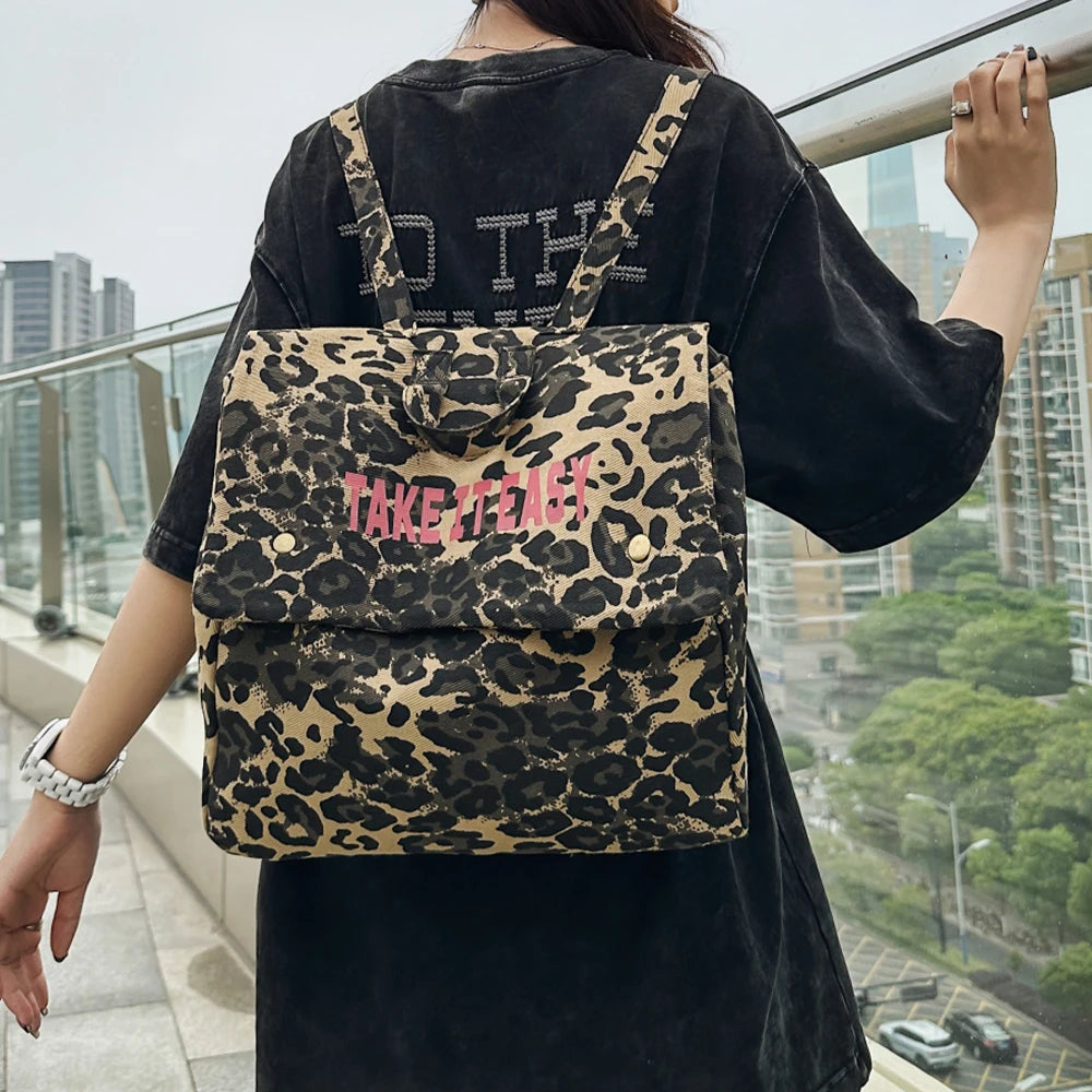 Mochila de lona con estampado de leopardo versión coreana 2025, nueva mochila de viaje de gran capacidad para primavera/verano, mochila para estudiantes