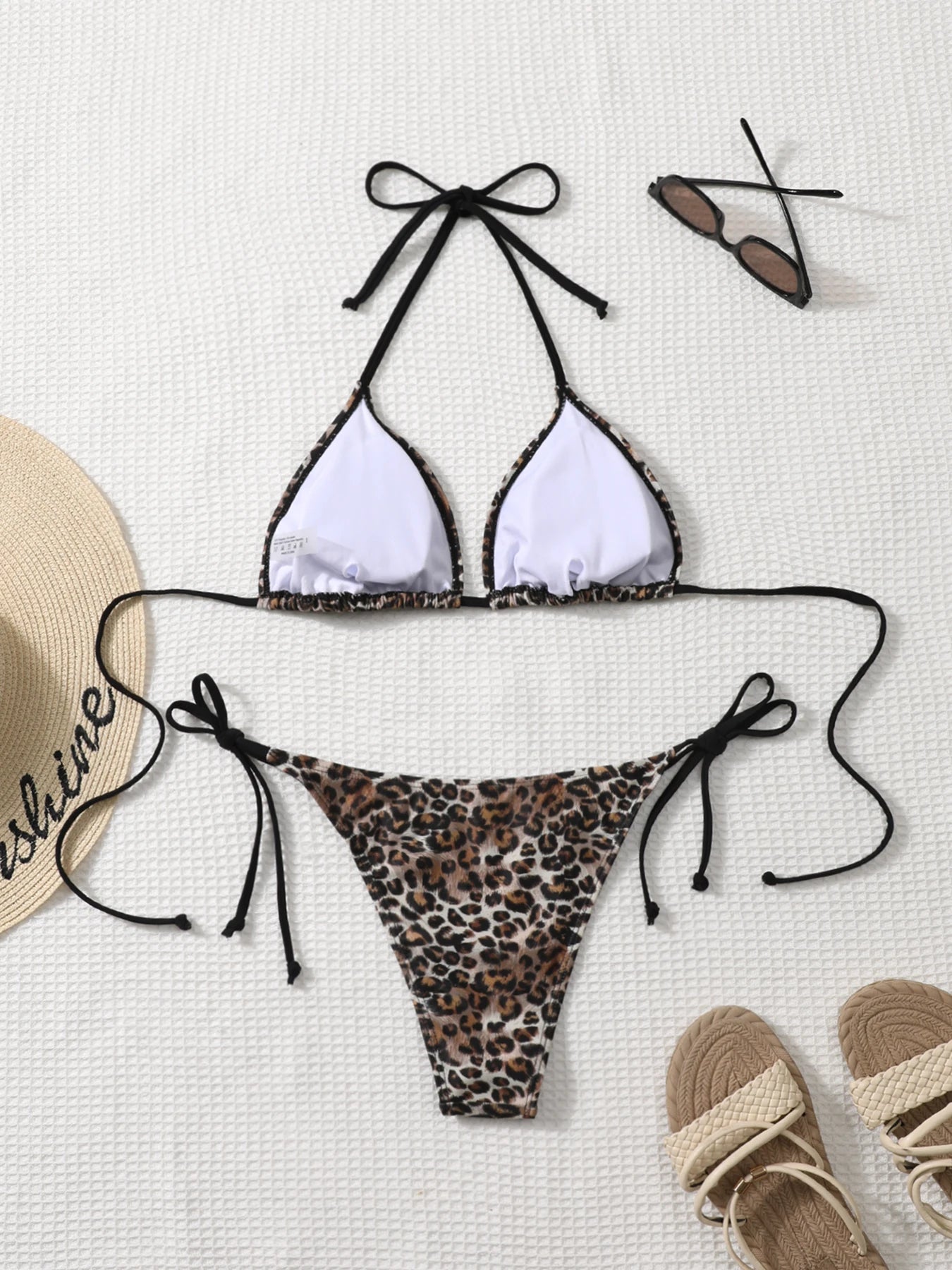 Traje de baño sexy plisado sin espalda con estampado de cebra Shencai, diseño de realce de glúteos, estilo europeo y americano, para venta transfronteriza.