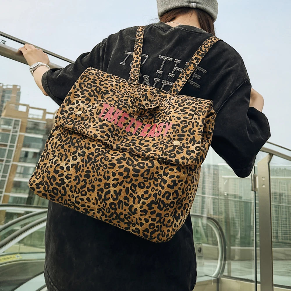 Mochila de lona con estampado de leopardo versión coreana 2025, nueva mochila de viaje de gran capacidad para primavera/verano, mochila para estudiantes