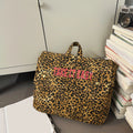 Mochila de lona con estampado de leopardo versión coreana 2025, nueva mochila de viaje de gran capacidad para primavera/verano, mochila para estudiantes