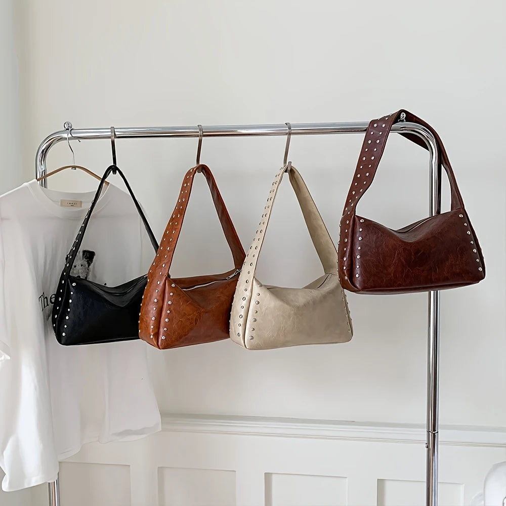 Bolso pequeño Retro, versátil para mujer, verano 2025, nueva moda, bolso de un solo hombro para axila, bolso de almohada con diseño de nicho con remaches