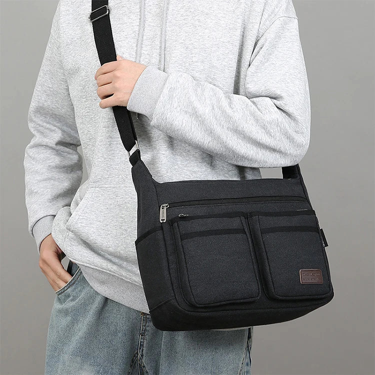 Bolso cruzado informal de negocios neutro: correas ajustables para los hombros, múltiples compartimentos con cremallera, paño de poliéster negro duradero